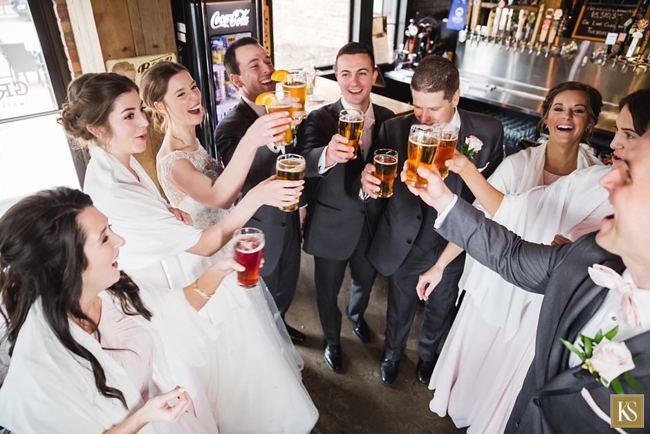 Bride and groom at bar with beer
